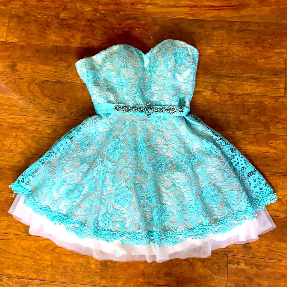 Worn only once for a graduation party.
